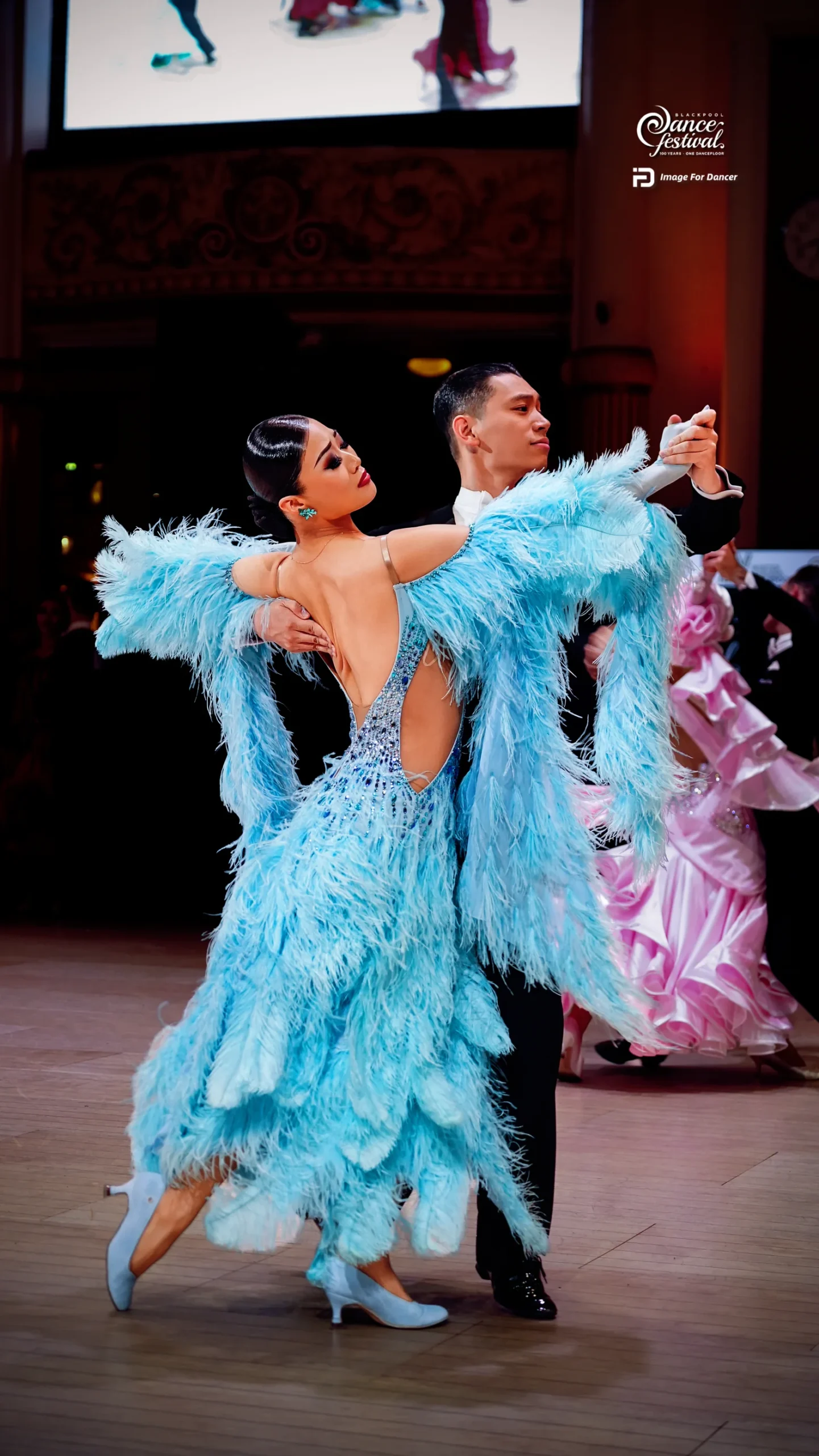 Ballroom dancers in blue at Blackpool 2026
